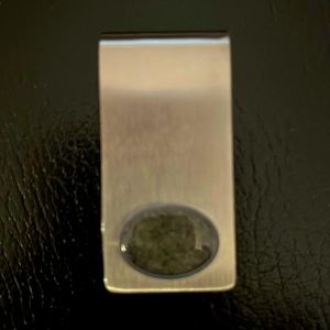 Stainless steel money clip with beach sand